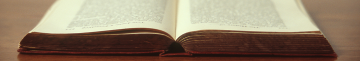 image of an open book on a table